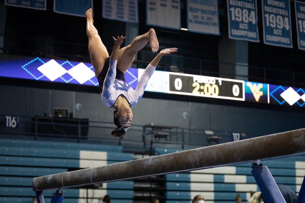 UNC senior Julianna Love performs on the beam during a gymnastics meet against West Virginia on Thursday, Feb. 24, 2022, at Carmichael Arena. UNC lost 195.225 - 196.250.