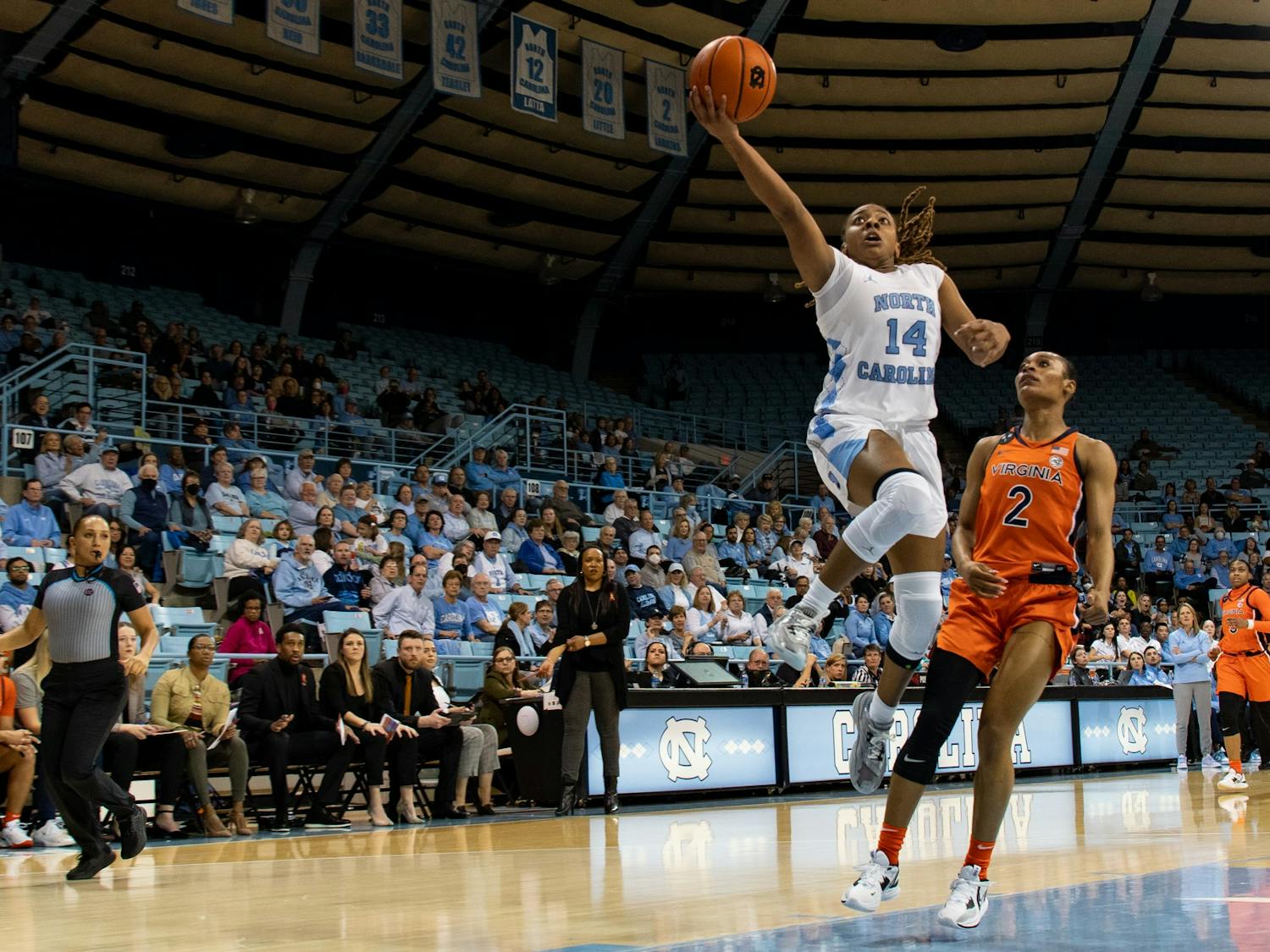 UNC redshirt first-year guard Kayla McPherson (14) goes up for a layup during UNC's game against UVA on Thursday, Feb. 2, 2023. UNC won 73-62. 