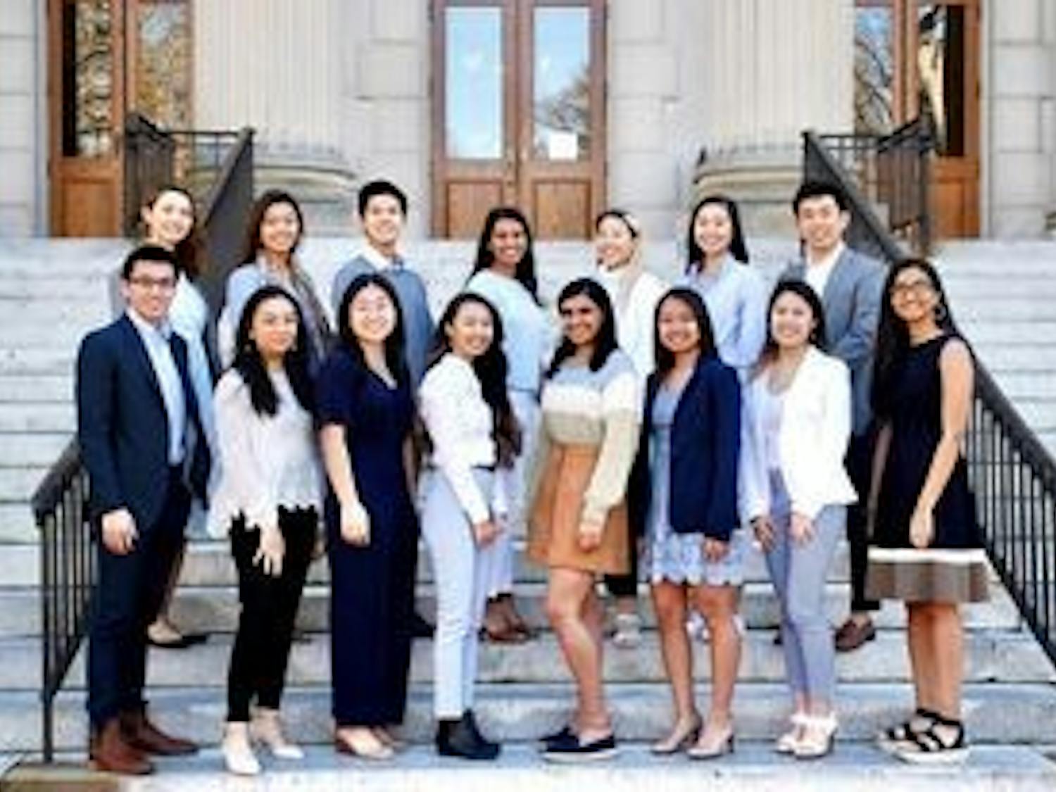 The Asian American Center Campaigns team poses for a portrait on the steps of Wilson Library. Photo courtesy of Lynne Chen.