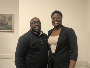 Brother and sister Robert Johnson (left) and Debra Johnson (right) pose together after the UNC School of Social Work's lecture 'Parenting Black Boys in America.'&nbsp;