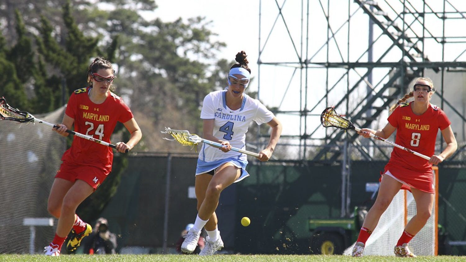 Marie McCool (4) goes for the ball between two Maryland defenders Saturday afternoon. The Tar Heels fell to 8-7.