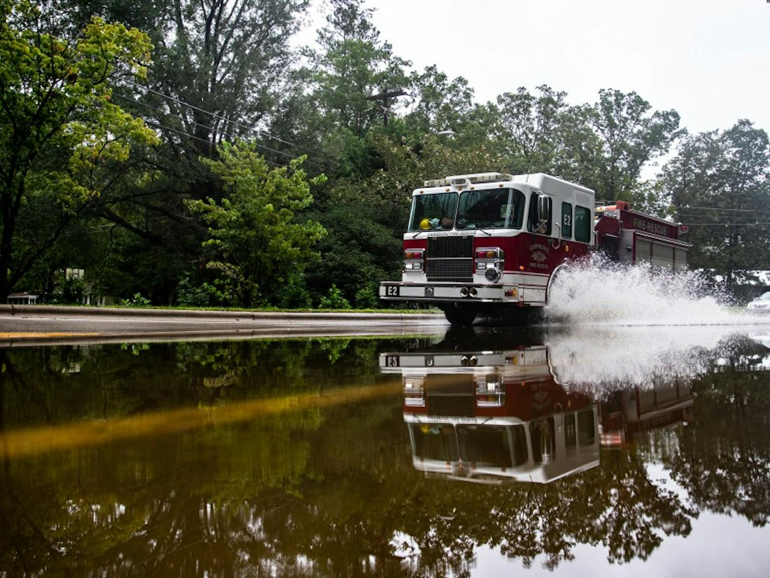 A Carrboro fire truck drives through a flooded section of North Greensboro Street on September 17, 2018. Parts of Carrboro and Chapel Hill experienced flash flooding after feeling minimal effects from Hurricane Florence in early September.&nbsp;