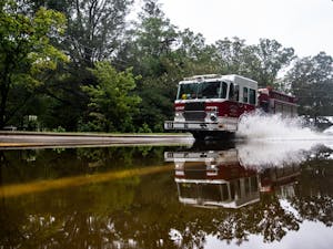 A Carrboro fire truck drives through a flooded section of North Greensboro Street on September 17, 2018. Parts of Carrboro and Chapel Hill experienced flash flooding after feeling minimal effects from Hurricane Florence in early September.&nbsp;