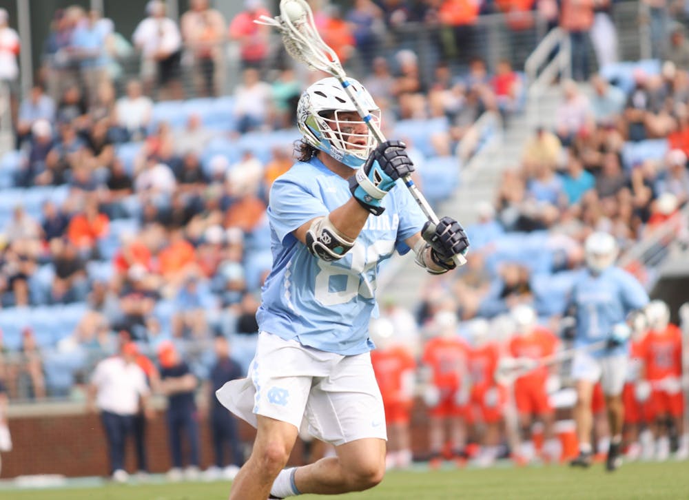 Junior defensive midfielder Alex Breschi (88) goes to make a buddy pass to a teammate against Syracuse. UNC beat Syracuse 14-13 at home on Saturday, April 16, 2022.