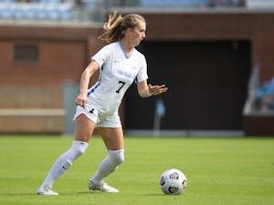 Junior defender Julia Dorsey (7) prepares to kick the ball in a game against the University of Virginia on Oct. 3. The Tar Heels tied with the Cavaliers 0-0.