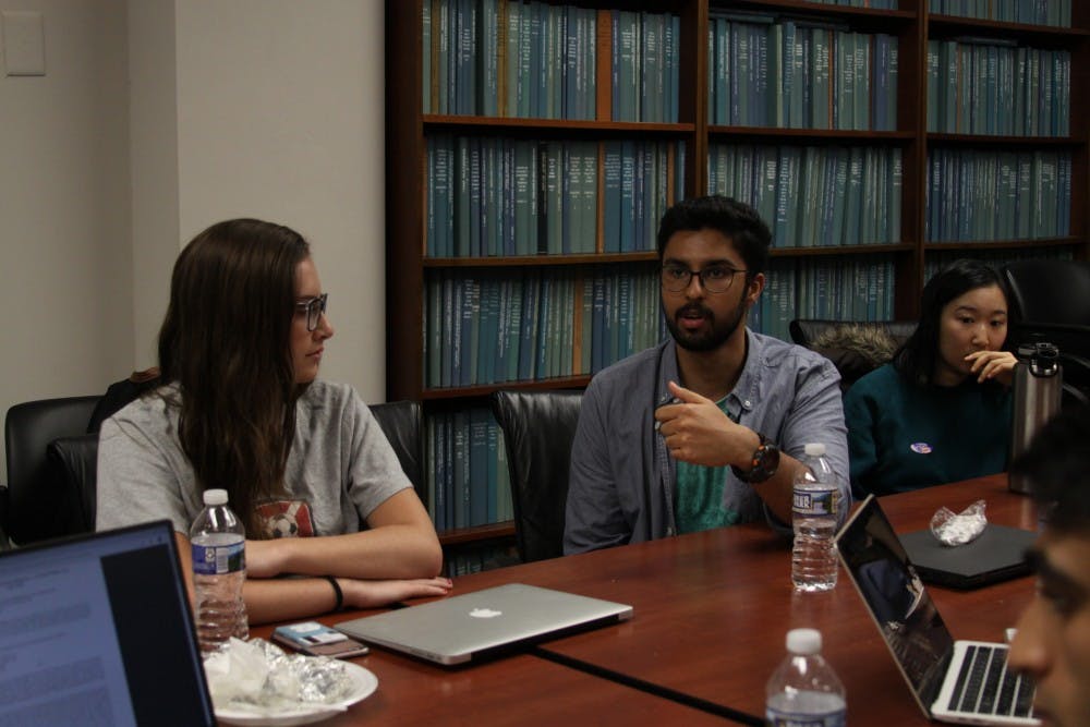 Anamay Viswanathan, senior political science major, offers his thoughts during a group discussion at a meeting with the "Tolerance in the Marketplace of Ideas" research fellowship in Davie Hall on Tuesday, Nov. 6, 2018.