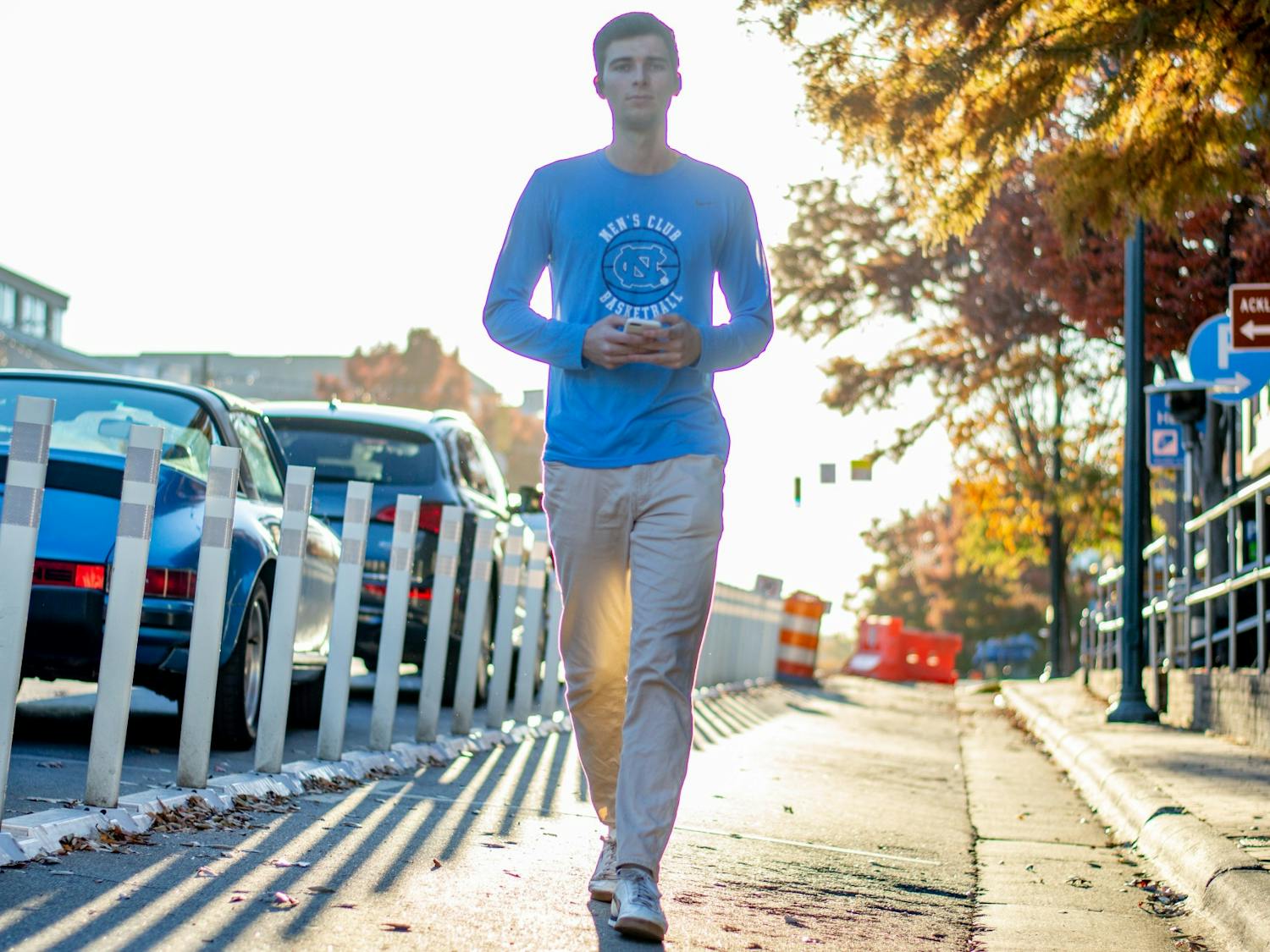 Assistant sports editor Hunter Nelson walks on Franklin Street on Nov. 16. Hunter is very fond of walking.