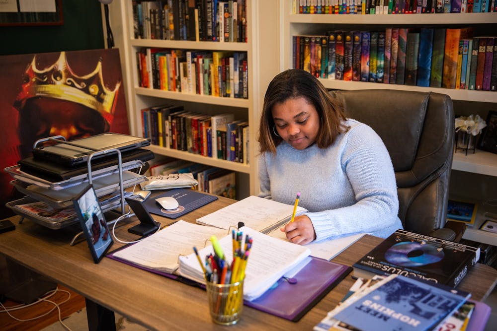 <p>Peyton Battle, a junior at Chapel Hill High School, practices calculus at her desk on Sunday, March 19, 2023.</p>