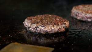 Burgers cook on a grill at Al’s Burger Shack on Wednesday, March 8, 2023. The restaurant is currently switching beef providers.