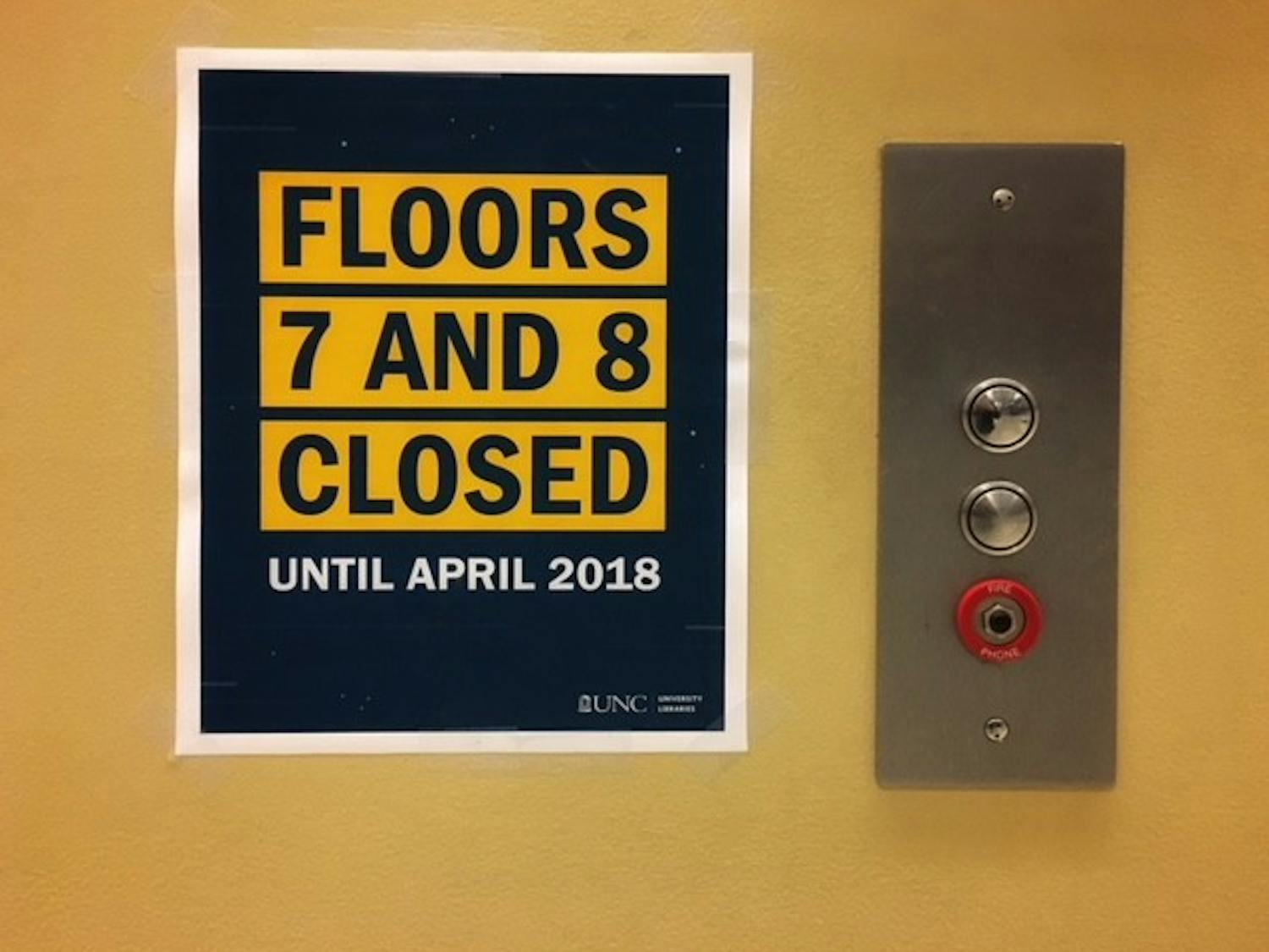 Signs in Davis Library regarding the construction project.