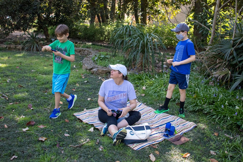A family plays in Coker Arboretum in Chapel Hill on April 5, 2021.