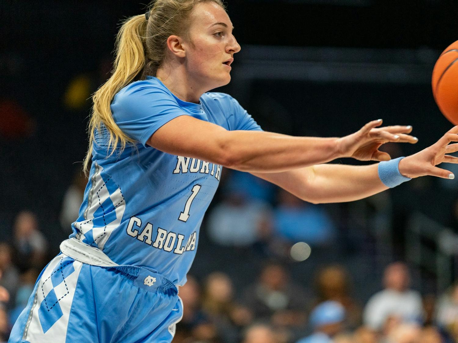 UNC junior guard Alyssa Ustby (1) passes the ball during the women’s basketball game against Michigan at the Jumpman Invitational on Tuesday, Dec. 20, 2022, at the Spectrum Center. UNC fell to Michigan 76-68.