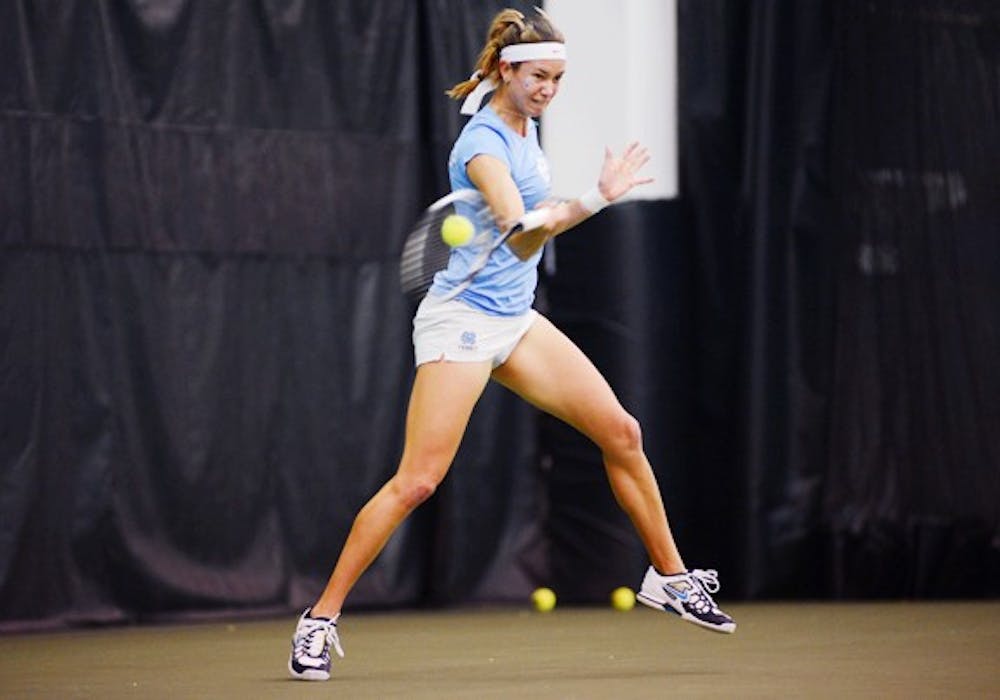 UNC Senior Zoe De Bruycker returns the ball in her doubles match against Collins/Janowicz.