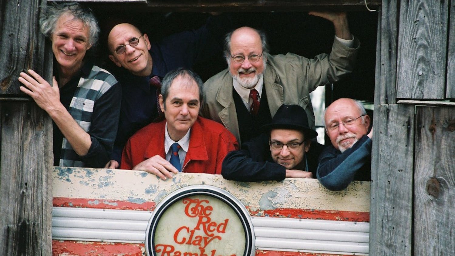 The Red Clay Ramblers, posing in an old wooden structure.Photo courtesy of Bland Simpson