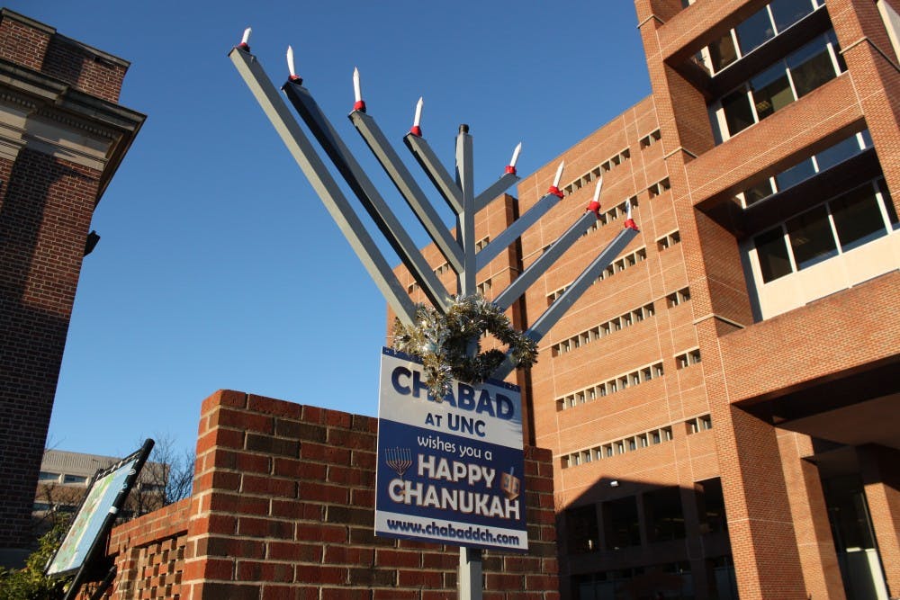 A menorah is placed outside the front of Lenoir Dining Hall by Chabad at UNC to celebrate Hanukkah, which begins on Sunday, Dec. 2, 2018 and ends Monday, Dec. 10, 2018. The menorah will be used at the menorah lighting in the Pit hosted by Chabad at UNC on Wednesday, Dec. 5, 2018.