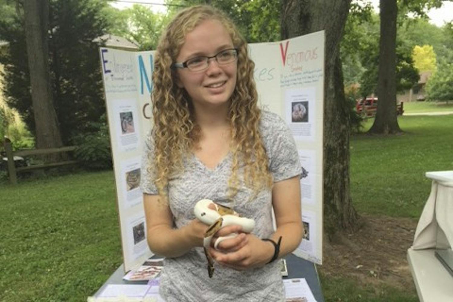 Nicole D’Avignon, president of the Carolina Wildlife Information and Science Education club, holds a snake. Carolina WISE is a new club. (Nicole D’Avignon)