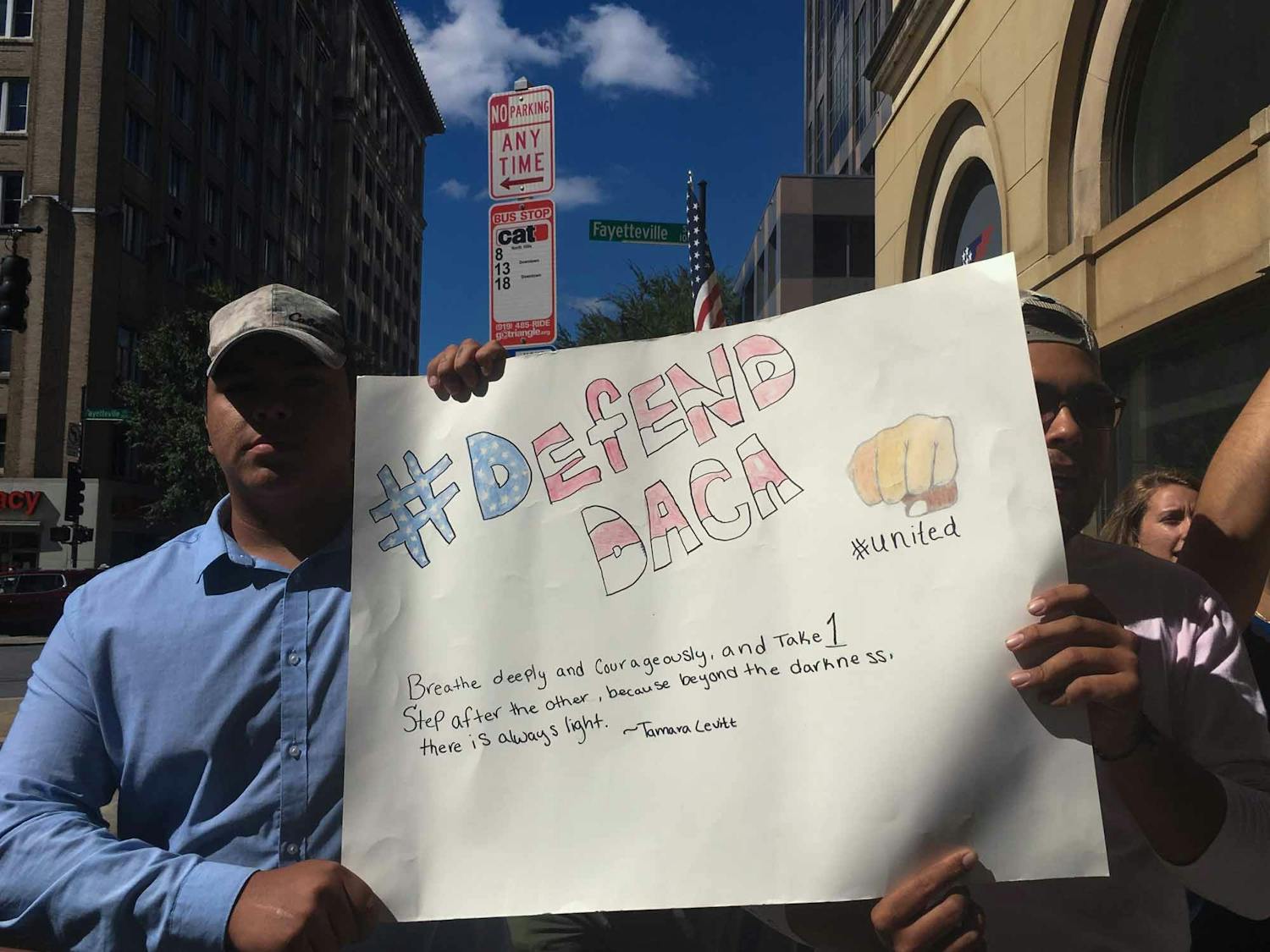 Protesters hold a sign during a demonstration in downtown Raleigh on Sunday, Oct. 1, 2017. About 250 people participated in the protest in support of DACA after President Donald Trump announced that he would phase out the program.