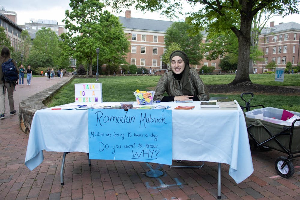 <p>UNC senior Rida Bayraktar sits at Polk Place on Friday, April 14, 2023. Bayraktar is the most recent vice president of the UNC Muslim Students Association which sets up a table every Friday and reaches out to other clubs on campus, in order to bring more people into the community and celebrate holidays, such as Ramadan, together.</p>