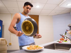 UNC sophomore Vishan Balyan plates his dinner in Hinton James Residence Hall on Monday, Oct. 26, 2020.