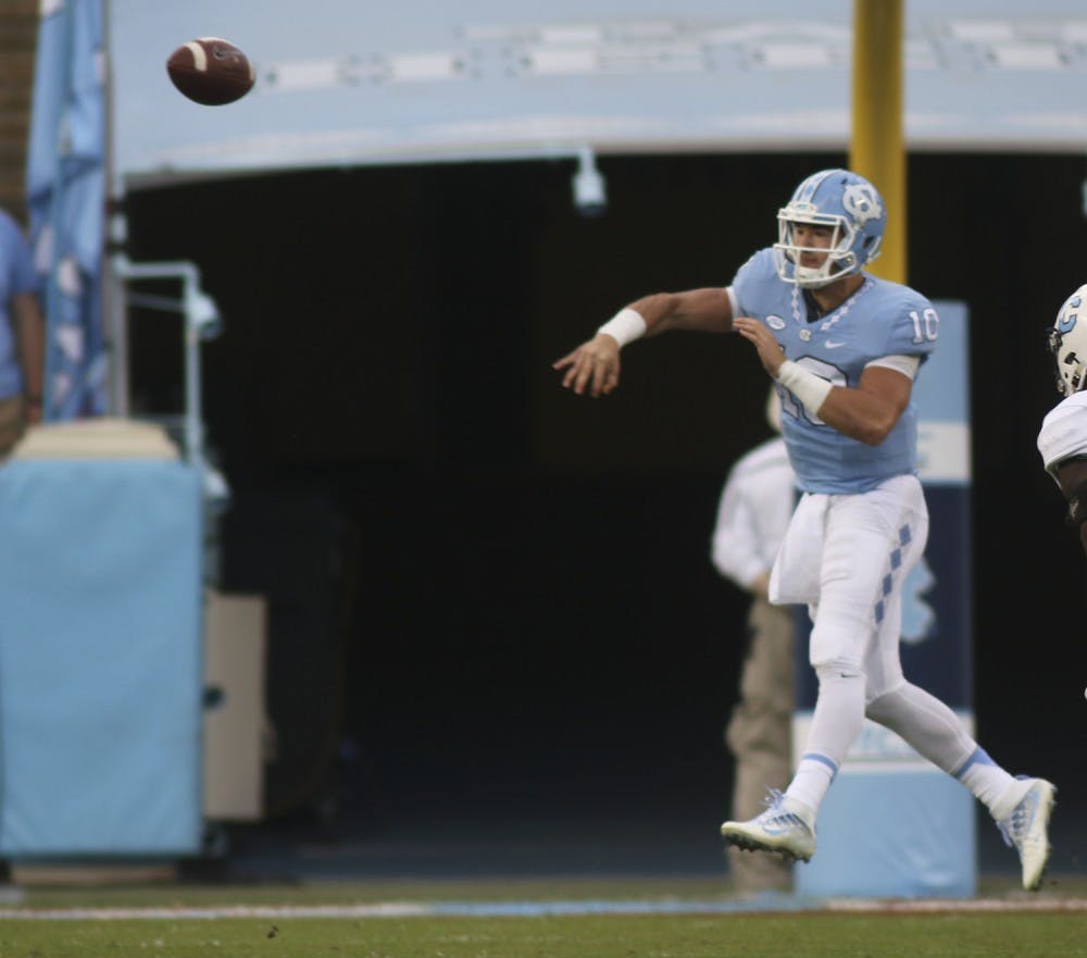 UNC quarter Mitch Trubisky (10) throws a pass on the run.