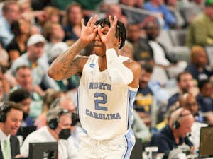 UNC sophomore guard Caleb Love (2) celebrates a three-pointer during the first round of the NCAA Tournament on Thursday, March 17, 2022, in Fort Worth, Texas, against Marquette. UNC won 95-63.