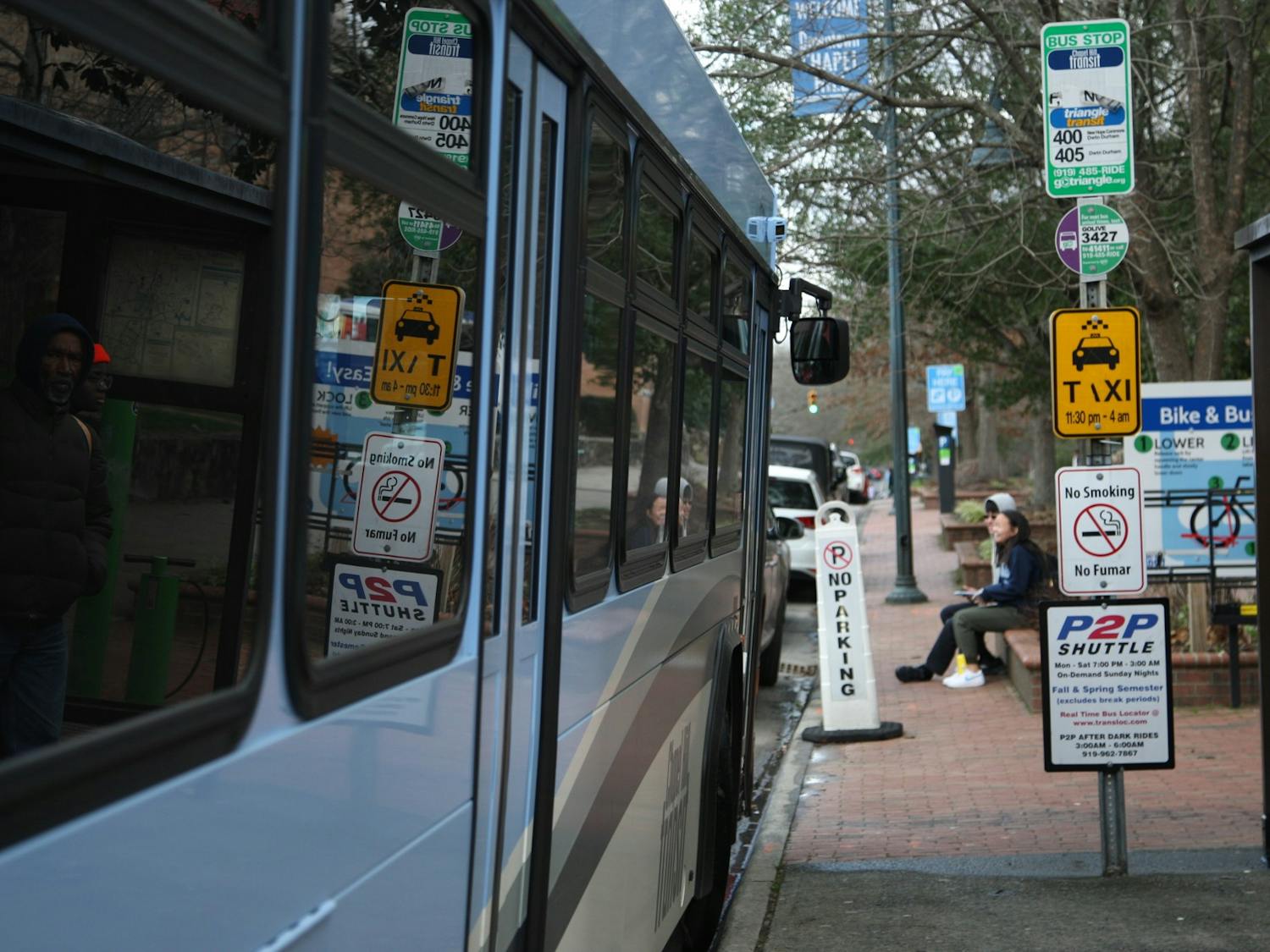 A Chapel Hill Transit bus stops outside Carolina Coffee Shop on Franklin Street on Feb. 7, 2020. The Civic Engagement Action Coalition of Transportation will launch a voting shuttle that will take students directly from South Campus to the early voting site on Feb. 27 and Feb. 28, 2020. The voting shuttle will run non-stop from 10 a.m to 6 p.m.
