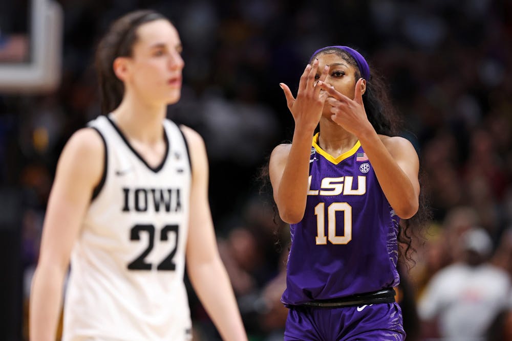 Angel Reese (10) of the LSU Lady Tigers reacts toward Caitlin Clark (22) of the Iowa Hawkeyes during the fourth quarter of the 2023 NCAA Women's Basketball Tournament championship game at American Airlines Center on Sunday, April 2, 2023, in Dallas.
Photo Courtesy of Maddie Meyer/Getty Images/TNS.