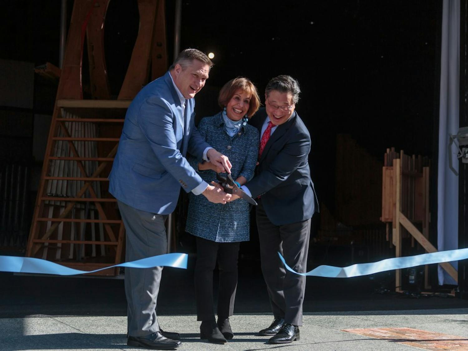 (From left) Chapel Hill Downtown Partnership Chairman Scott Maitland, Chancellor Folt, and CPA Executive and Artistic Director Emil Kang cut the ribbon for the new CURRENT ArtSpace + Studio on Feb. 2, 2018.