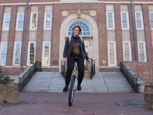 Jasper Christie, a first-year computer science major, rides their unicycle during a break between classes in front of Murphy Hall on Monday, Feb. 25, 2019.