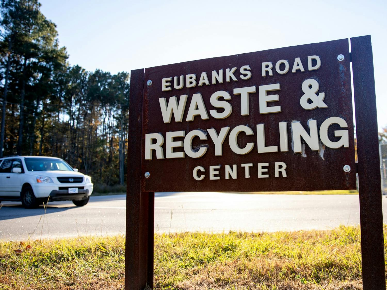 A car drives by the Orange County Eubanks Road Waste and Recycling Center on Nov. 14. The waste drop-off site hosts several composting bins as part of the Town of Chapel Hill's composting program.