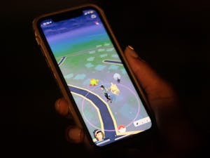 DTH Photo Illustration. A student plays Pokemon Go, a game that became popular in the summer of 2016.&nbsp;