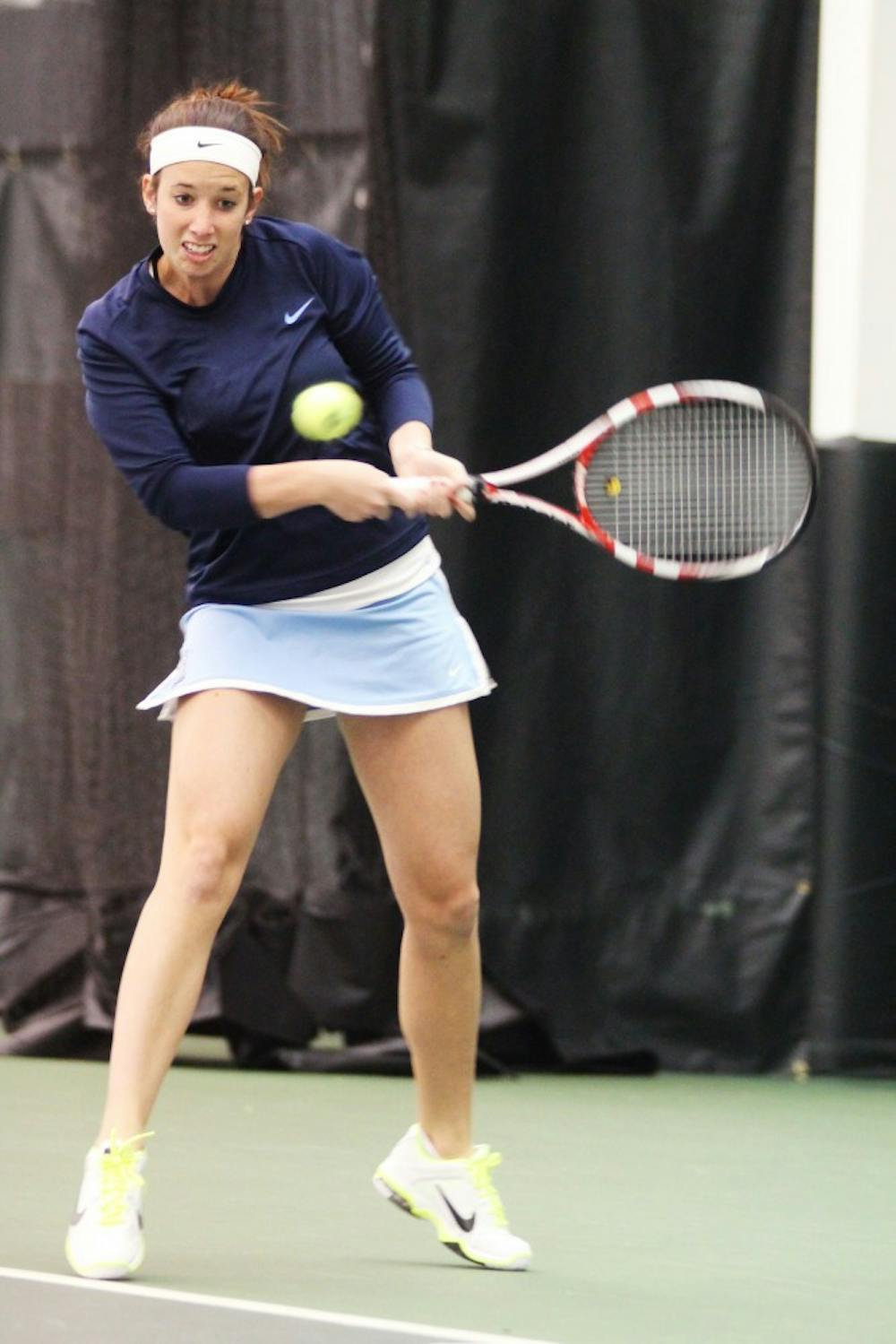 Tessa Lyons, junior plays a singles match against Elon.