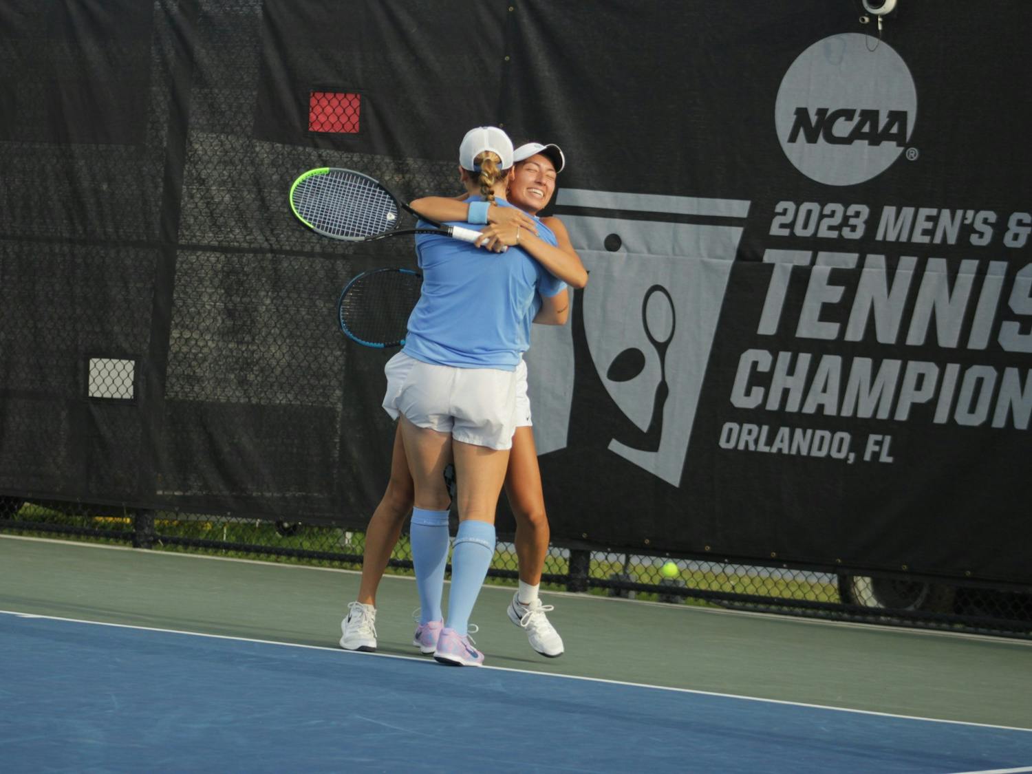 First-year Reese Brantmeier and junior Reilly Tran celebrate after securing the doubles point against N.C. State on Saturday, May 20, 2023. The Tar Heels won, 4-1.