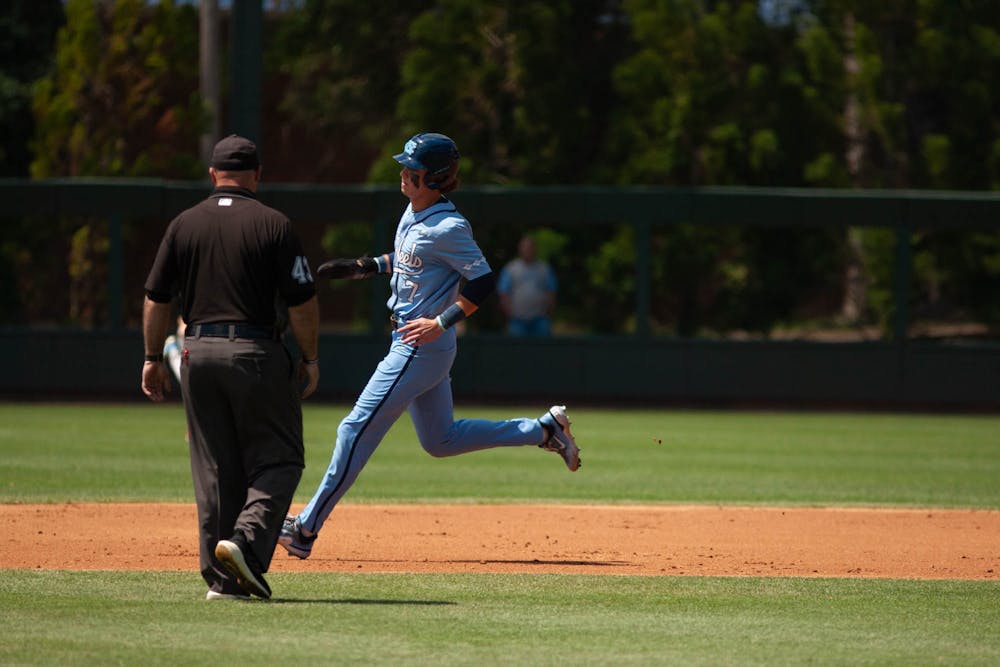 Sophomore outfielder Vance Honeycutt (7) runs to third base during the baseball game against Boston College on Sunday, April 23, 2023, at Boshamer Stadium. UNC fell to Boston College 2-6.