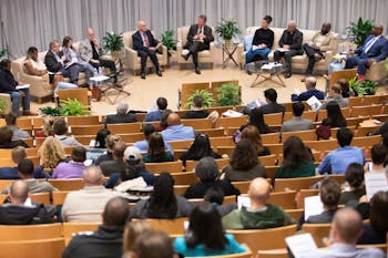 Chancellor Kevin Guskiewicz (center) and other campus leaders speak onstage in the Genome Sciences Building during the 2020 Summit on Safety and Belonging. The Summit addressed six key aspects of the campus climate, according to conversation and research: police behavior, sexual violence and danger, communications and Alert Carolina, physical safety, anti-racist activism and safety of marginalized communities.
