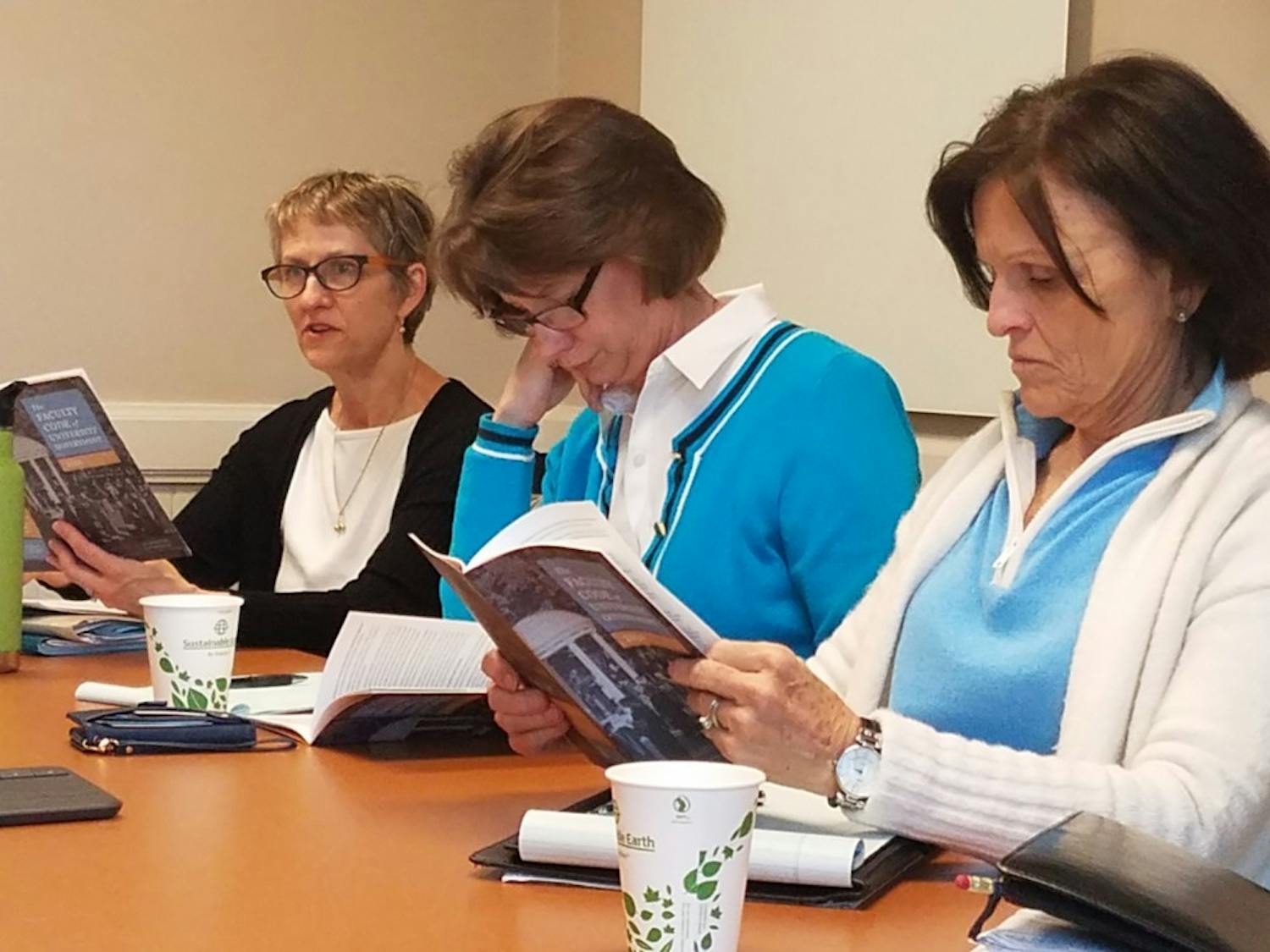 University Government Committee members (from left to right) Anne Klinefelter, Joy Renner and Suzanne Gulledge review the wording in the Faculty Code. The University Government Committee met on Wednesday to discuss any possible changes to the Code. 
