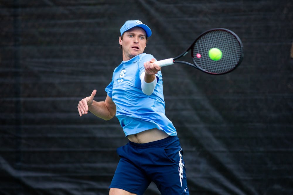 Senior Brian Cernoch hits the ball during the UNC's match against Louisville at the Chapel Hill Tennis Club on March 25th, 2022. UNC won 4-1.