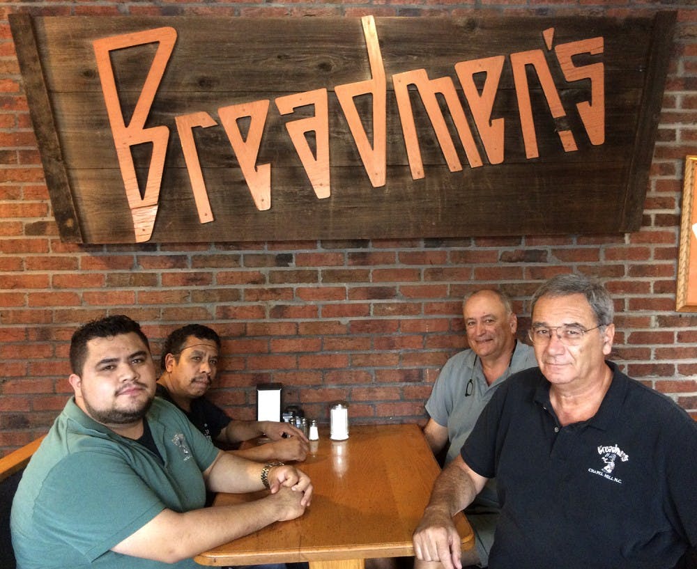 Breadmen's employees Omar Castro and Luz Castro, along with Bill Piscitello and Roy Piscitello, the owners of Breadmen’s, pose together.