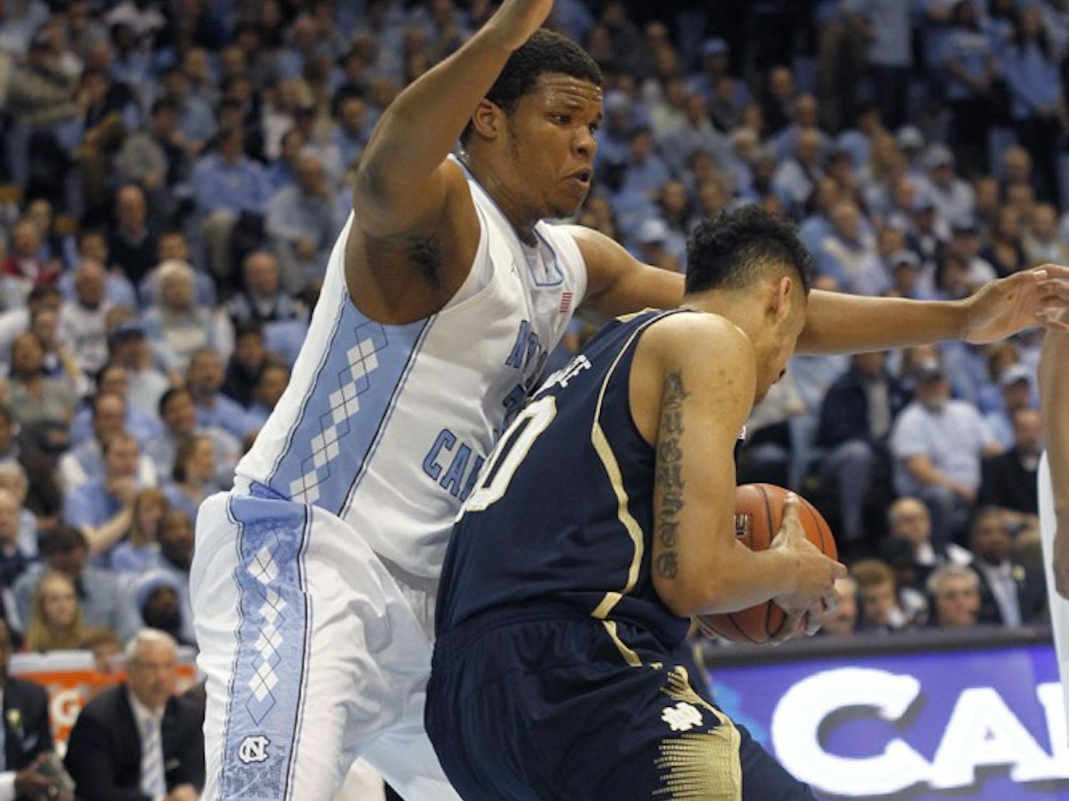Freshman forward Kennedy Meeks (3) guards the paint against a Notre Dame player. Carolina defeated Notre Dame 63-61 on Monday in the Dean Dome. 