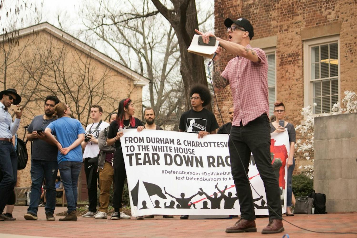 Asian studies professor Dwayne Dixon was among the faculty members receiving death threats from white supremacist groups. Dixon spoke during Wednesday's anti-fascism rally on UNC campus.