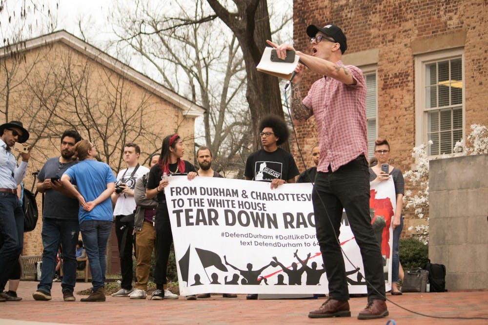 <p>Asian studies professor Dwayne Dixon was among the faculty members receiving death threats from white supremacist groups. Dixon spoke during Wednesday's anti-fascism rally on UNC campus.</p>