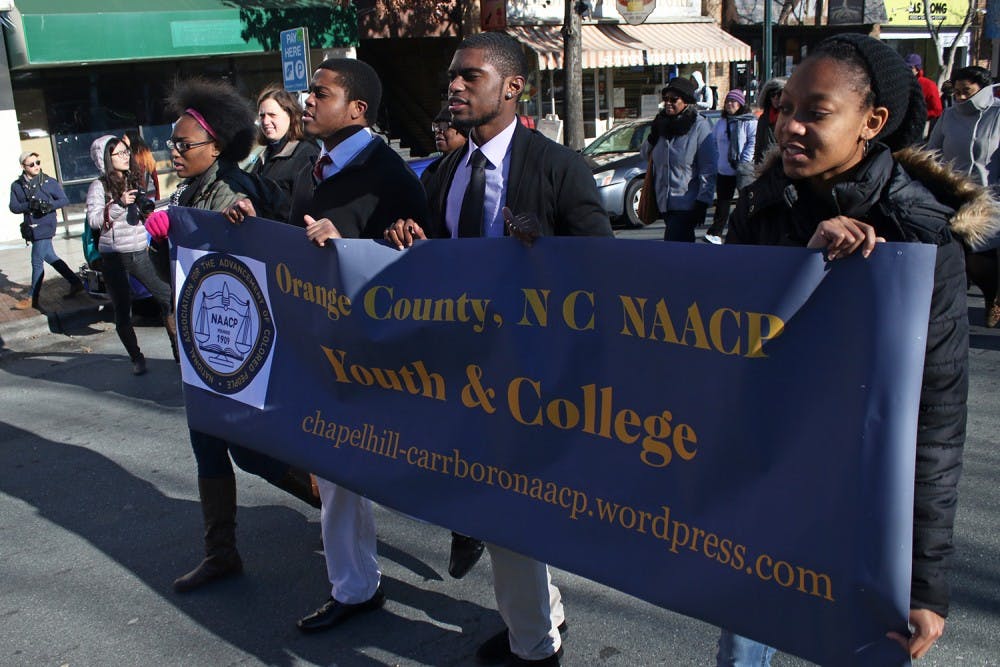 Members of the Chapel Hill-Carrboro NAACP participate in a march on Franklin Street as a part of their annual celebration of Martin Luther King Jr. Day.