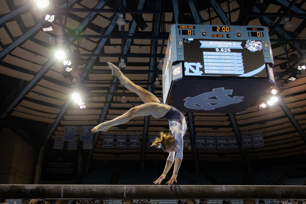 Sophomore Jamie Shearer performs her beam routine during the Tar Heels' senior night meet against West Virginia on Feb. 24th, 2022. UNC lost 195.225 - 196.250.