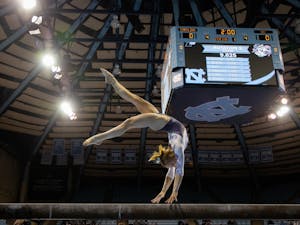 Sophomore Jamie Shearer performs her beam routine during the Tar Heels' senior night meet against West Virginia on Feb. 24th, 2022. UNC lost 195.225 - 196.250.
