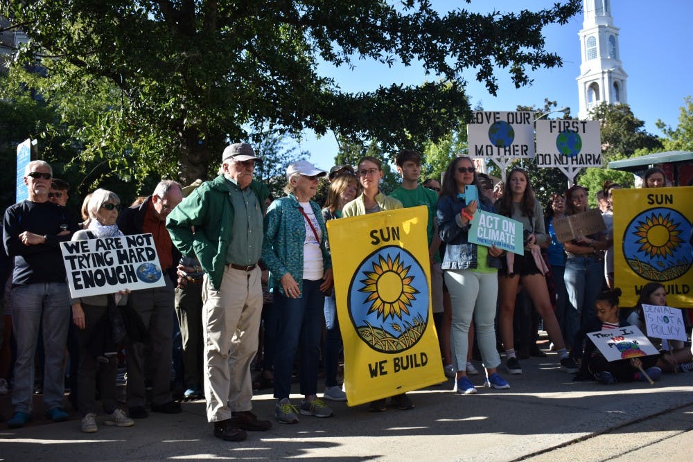 <p>Participants of the Chapel Hill climate strike stand in the Peace and Justice Plaza in Chapel Hill on Friday, Sept. 20, 2019 to demand that the Chapel Hill Town Council calls for a national Green New Deal.&nbsp;</p>