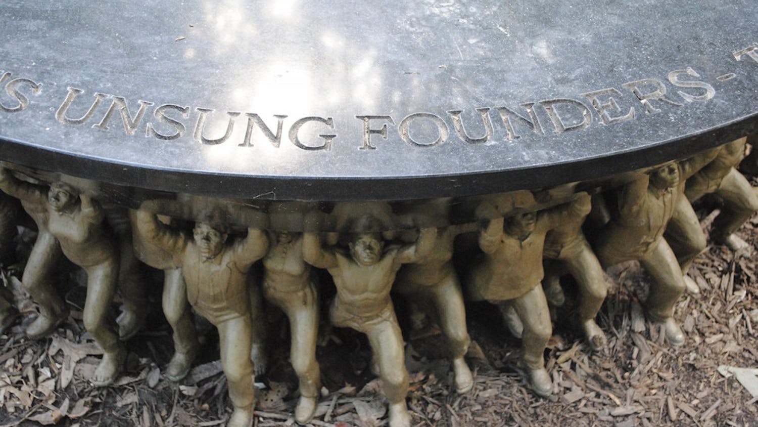 The Unsung Founders Memorial, found in McCorkle Place, reads "The class of 2012 honors the university's unsung founders- the people of color, bound and free, who helped build the Carolina that we cherish today."