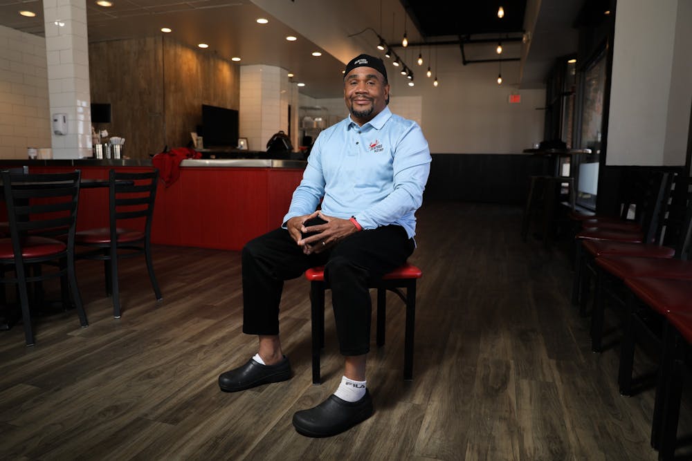 <p>Anthony Knotts, president of the Seafood Destiny Group, poses in the chain's new Franklin Street location on Thursday, Jan. 6, 2022.</p>