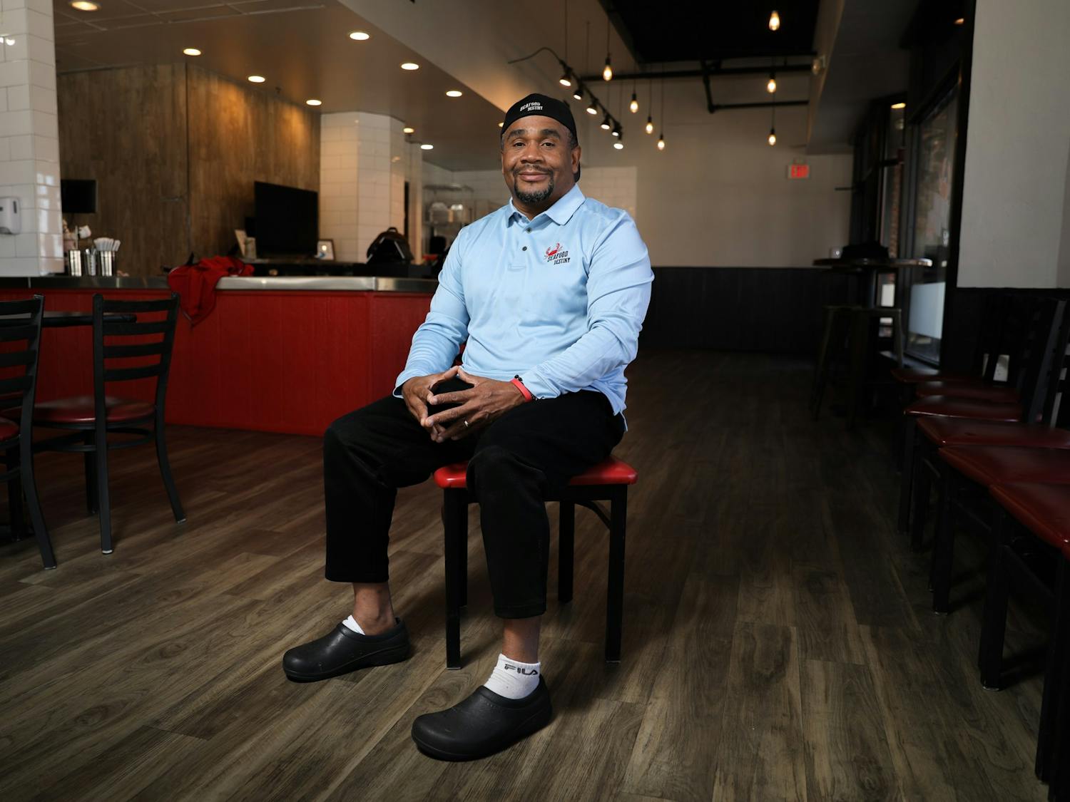 Anthony Knotts, president of the Seafood Destiny Group, poses in the chain's new Franklin Street location on Thursday, Jan. 6, 2022.