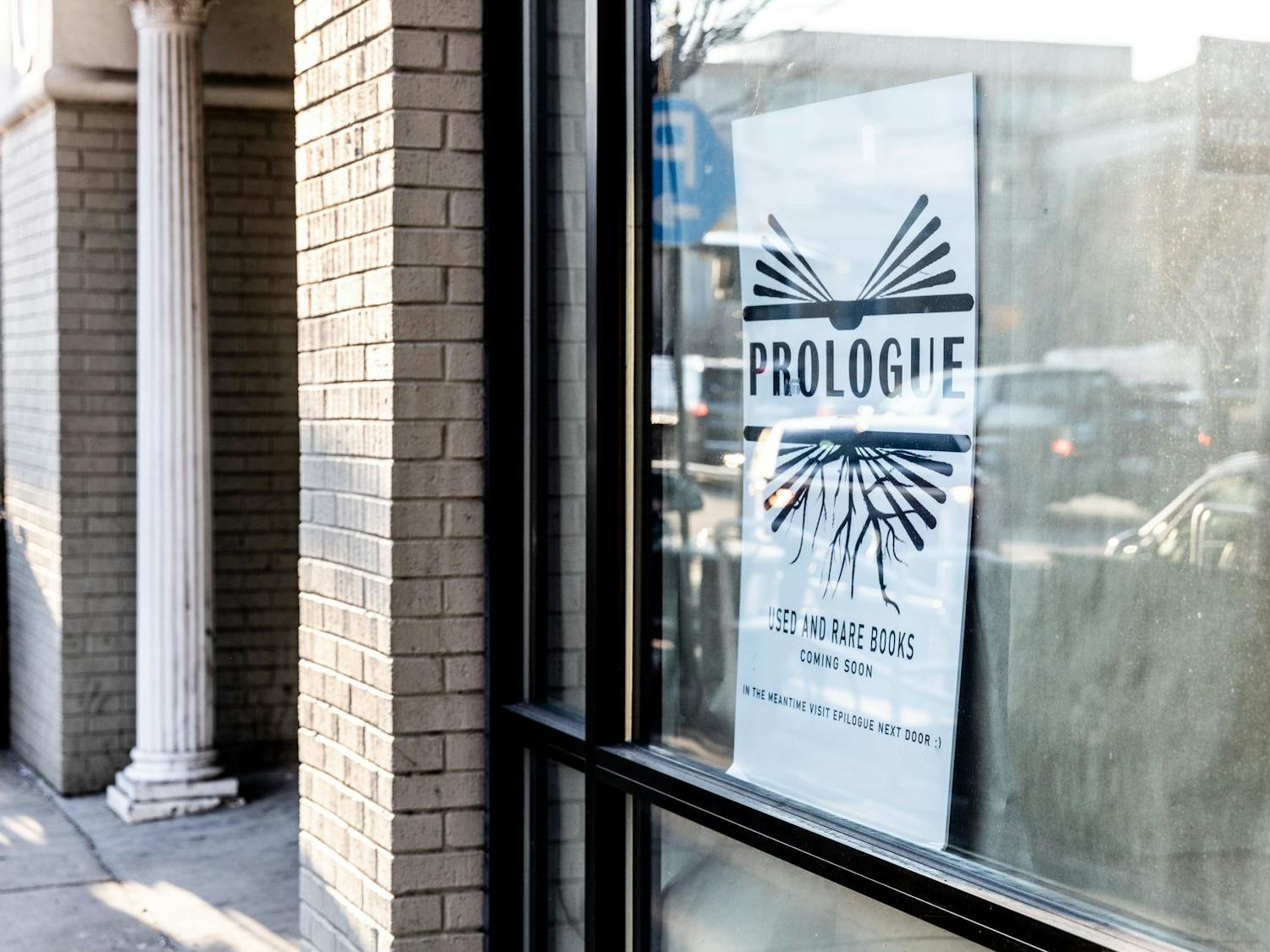 A "coming soon" sign stands in the window on Franklin St. where Prologue was set to reopen in 2021.