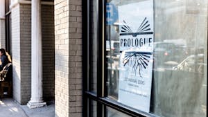 A "coming soon" sign stands in the window on Franklin Street where Prologue is set to open.